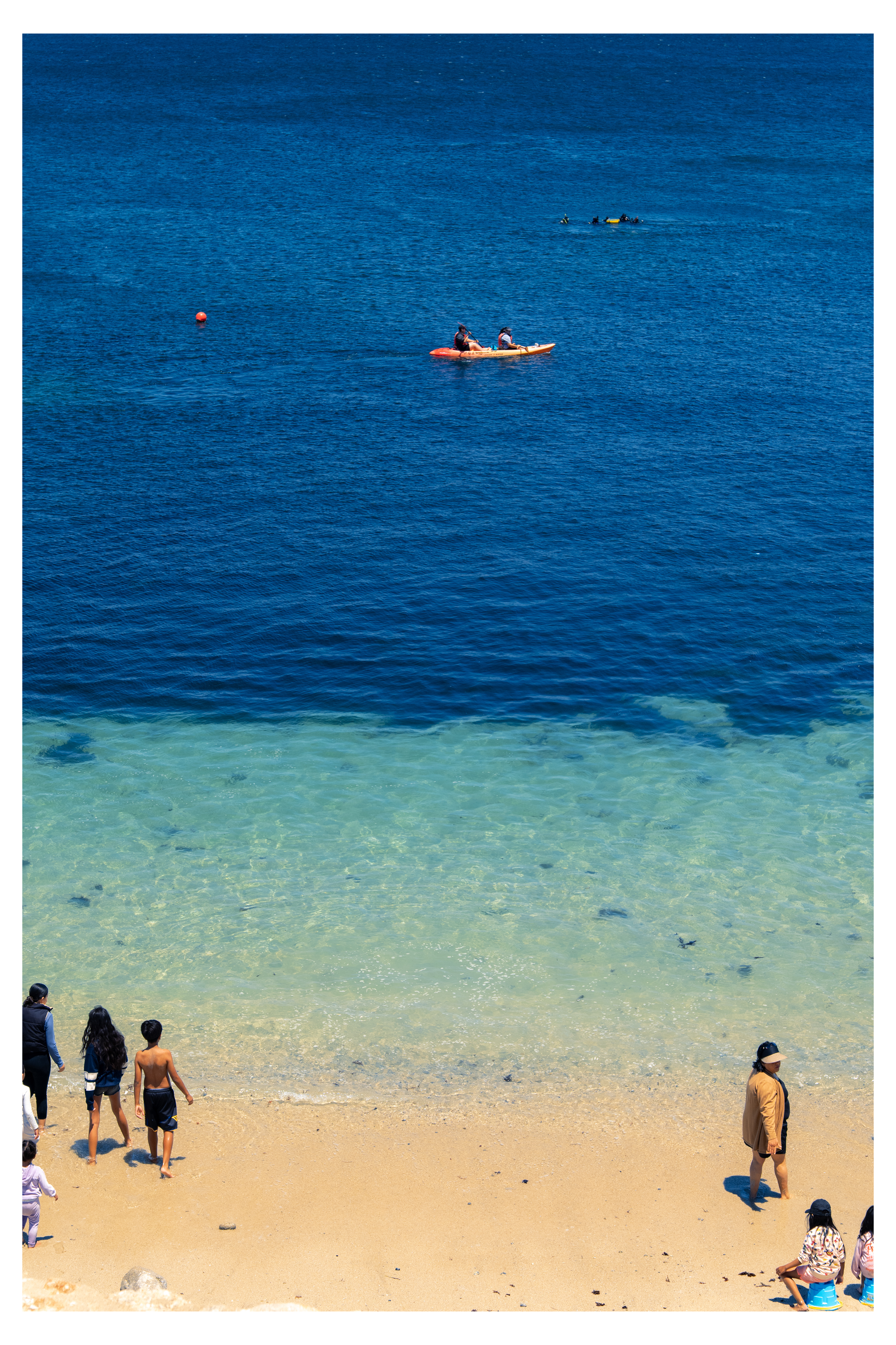 Kayakers in blue water